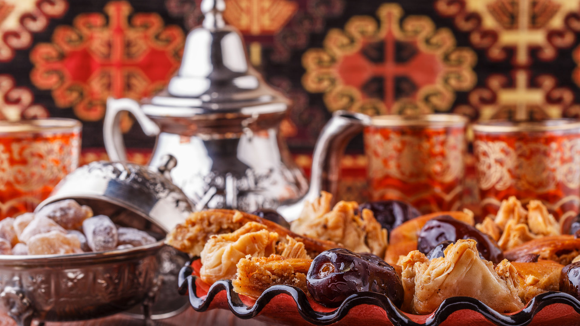 Traditional Moroccan mint tea set with a variety of pastries
