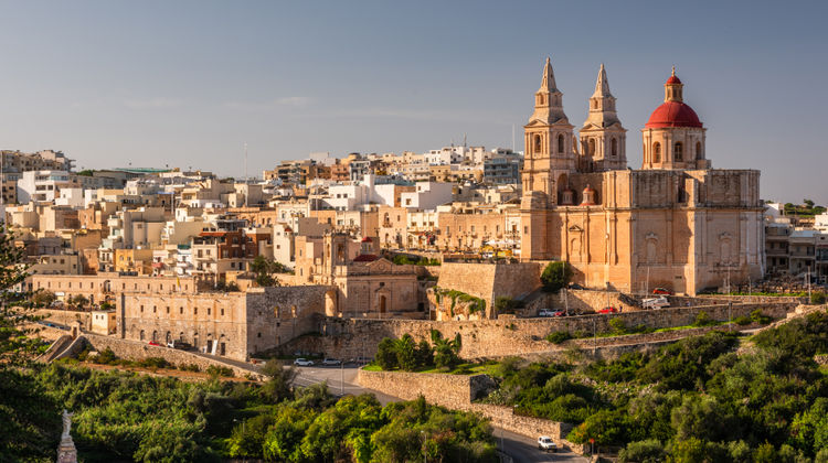 Mellieha Town at sunny day with Paris Church on Hill Top, Malta
