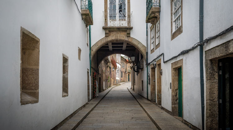 Arched house in the medieval street of Santa Maria, Guimarães