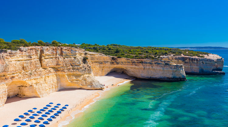 Aerial view of Praia da Marinha’s golden sands.