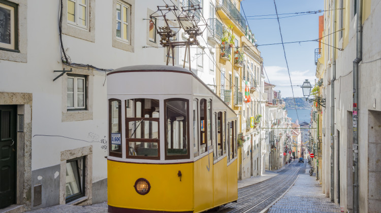 Ride through old Lisbon aboard the famous yellow tram