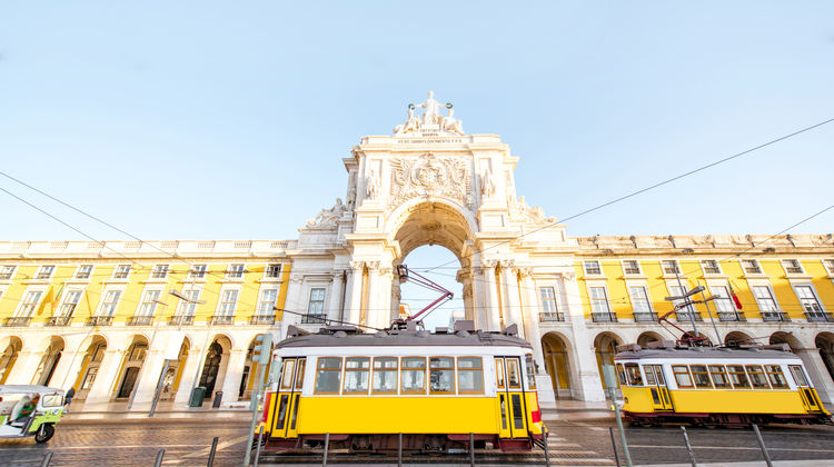 Yellow Tram Passing Through Praça do Comércio and Rua Augusta Arch, Lisbon