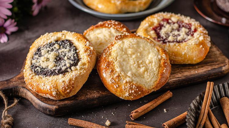 Kolache, a type of sweet pastry that holds a portion of fruit surrounded by puffy yeast dough