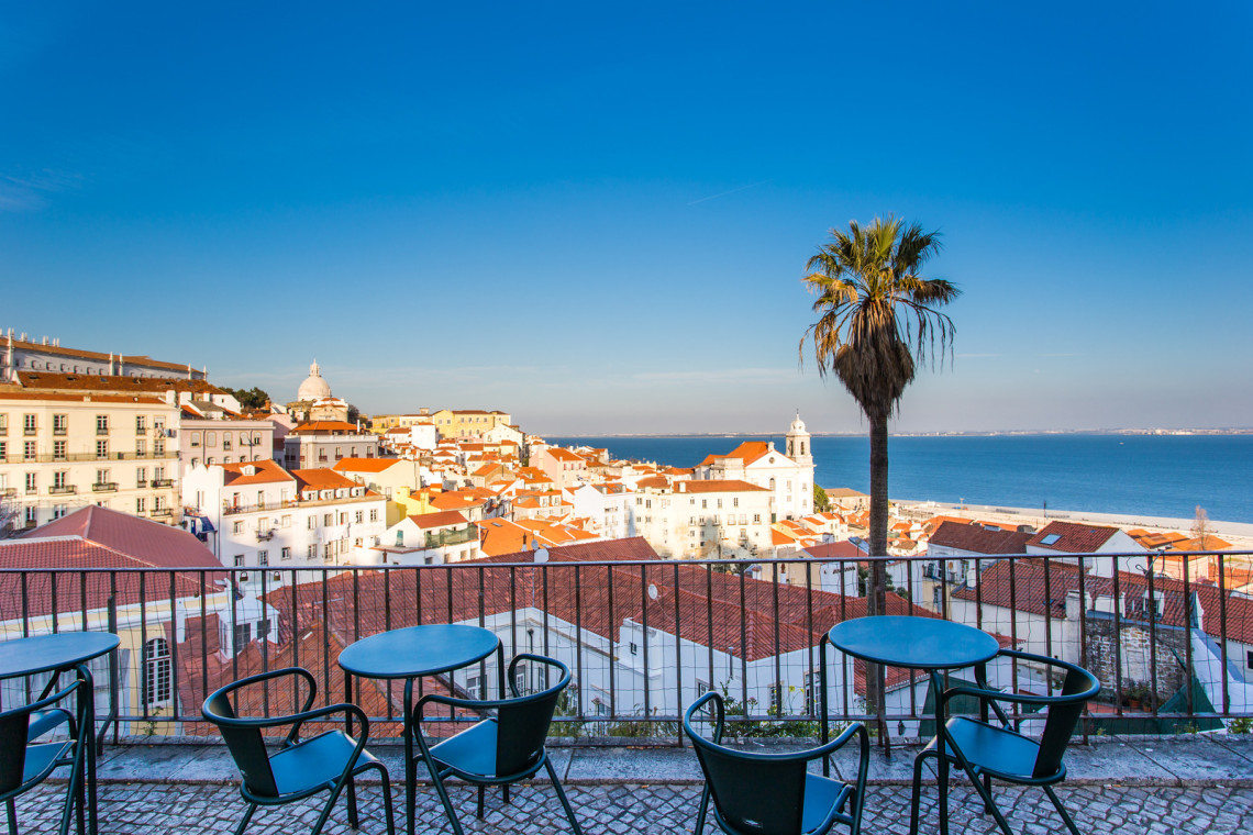 Open café tarrace in Lisbon Open café tarrace with breathtaking view at Alfama - historical city-center of Lisbon, Portugal