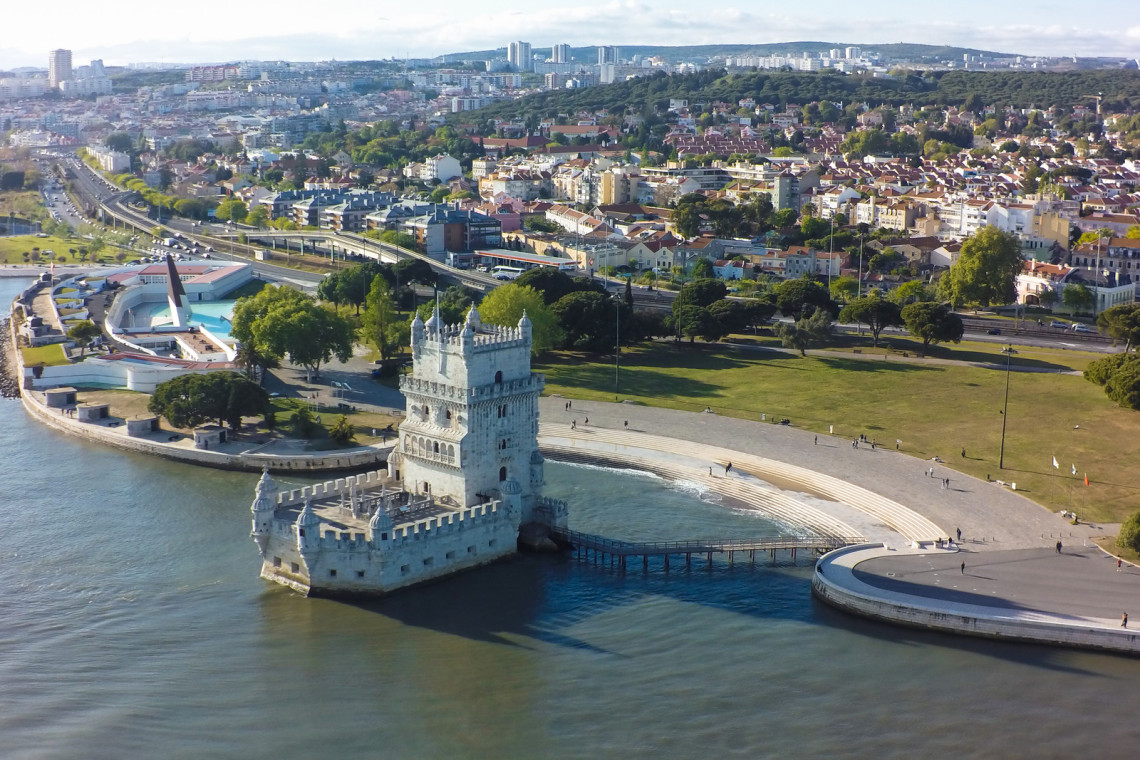 Belem District in Lisbon, Portugal Aerial view of Belem Tower beside Tagus river during sunset