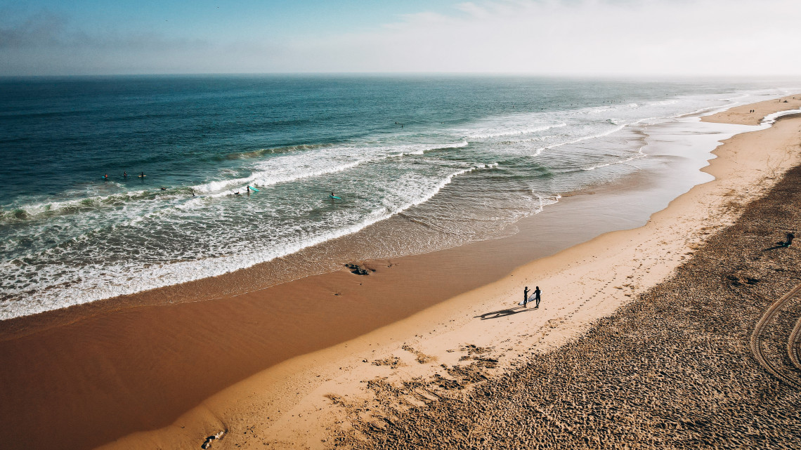 sand-surfers-ocean-water-wave-beach-carcavelos-portugal-sun