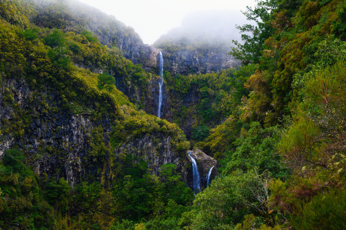 View of the Cascata do Risco waterfalls at the end of the Levada das 25 Fontes hiking trail, Rabaçal, Madeira View of the Cascata do Risco waterfalls at the end of the Levada das 25 Fontes hiking trail, Rabaçal, Madeira