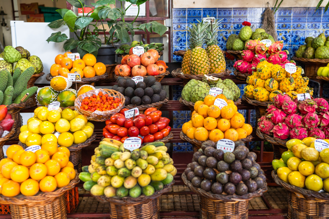 Tropical Fruits at Funchal Market – Madeira Island Local Produce Colorful exotic fruits at Mercado dos Lavradores in Funchal, Madeira Island, Portugal, including passion fruit, dragon fruit, and anonas