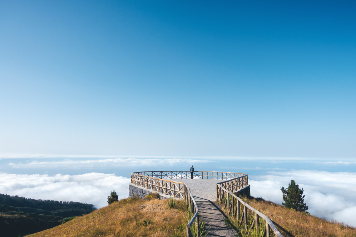 Woman enjoying the view from panoramic platform on Madeira Island.