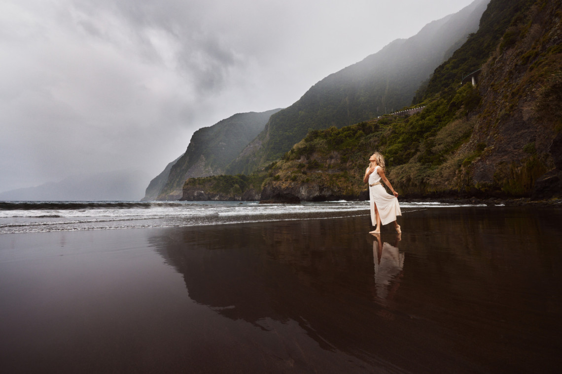 Young carefree woman on Seixal beach at Portugal.