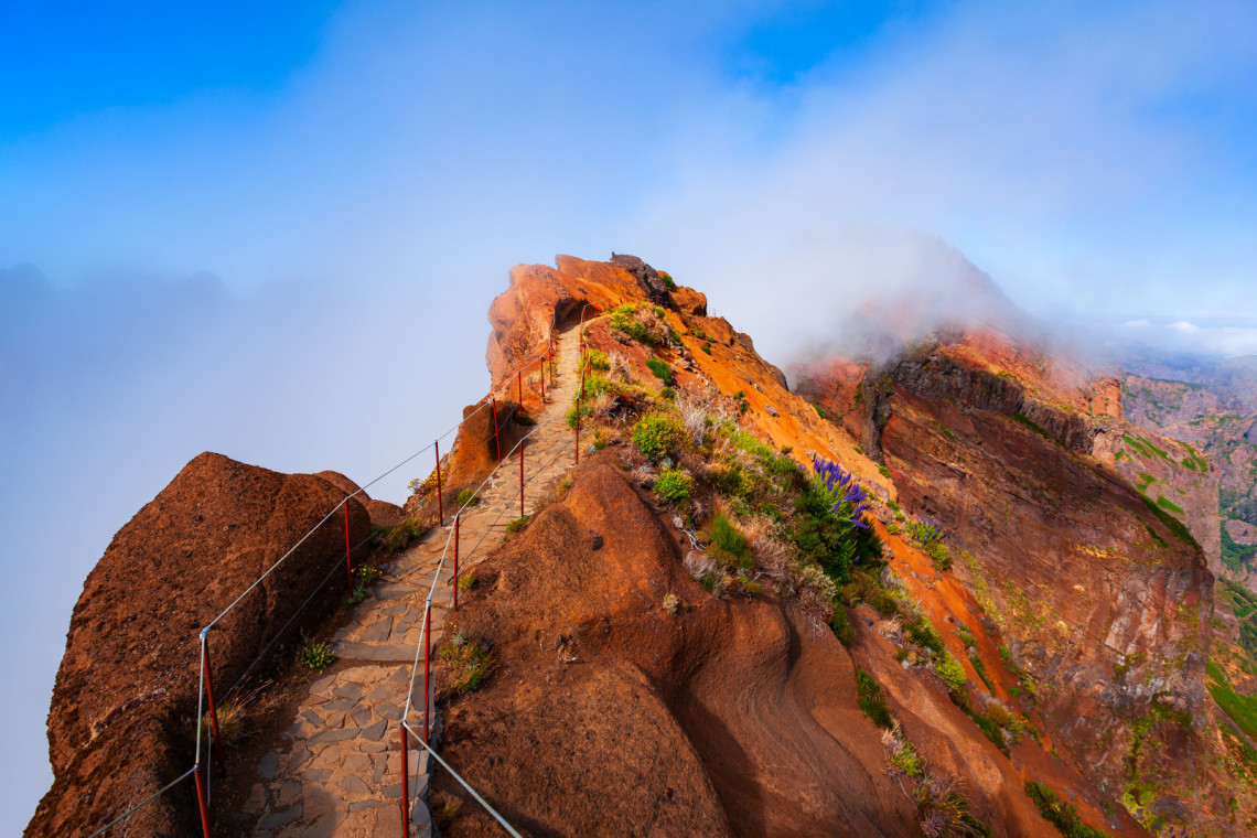 A hiking trail into the mountain, at the Pico do Arieiro, in Madeira Island