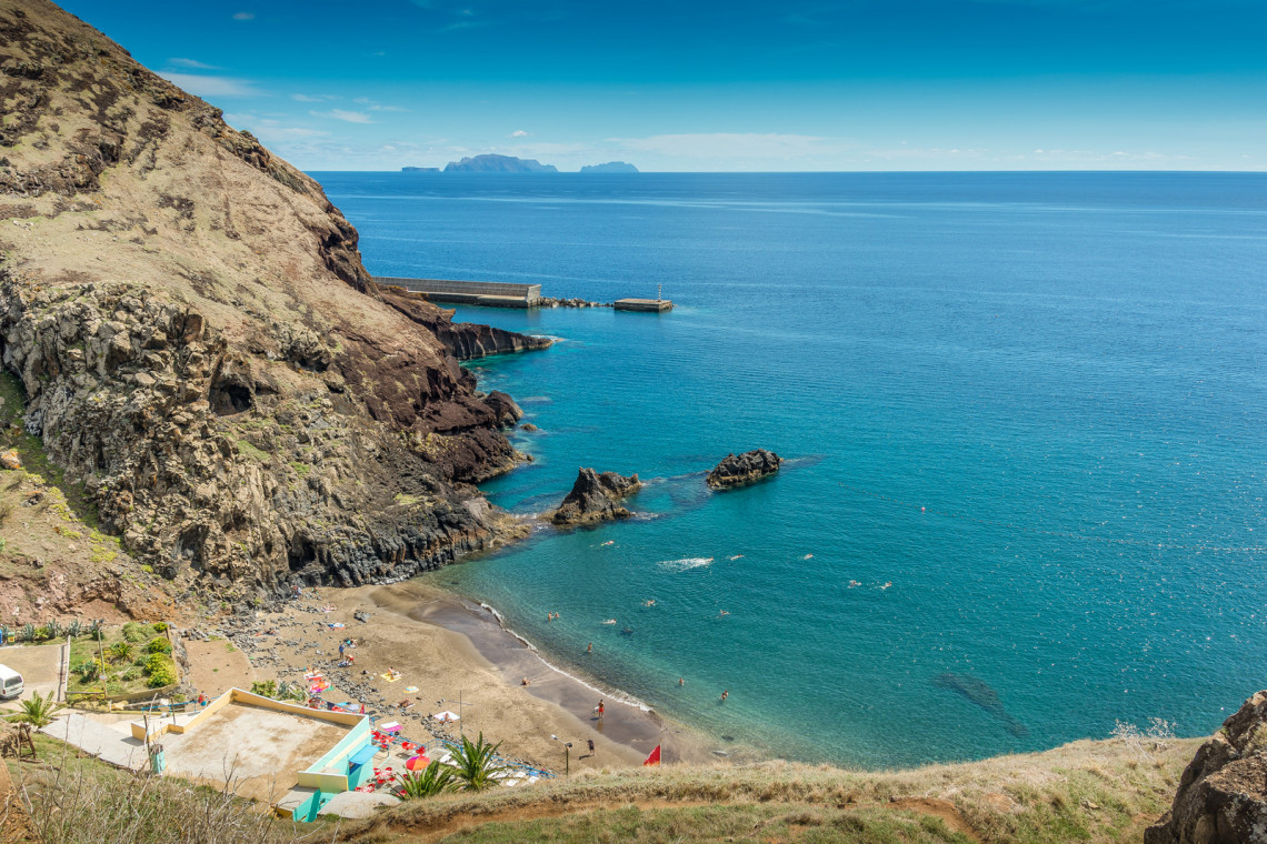 Secluded sandy beach on the south east coast of Madeira island