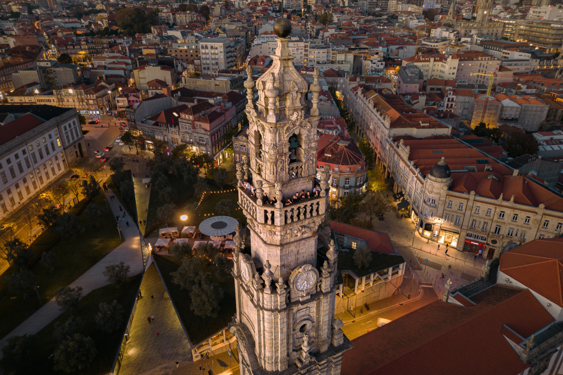 Aerial View of Historic Landmark Clerigos Tower at Dusk in Porto Aerial View of Historic Landmark Clerigos Tower at Dusk in Porto