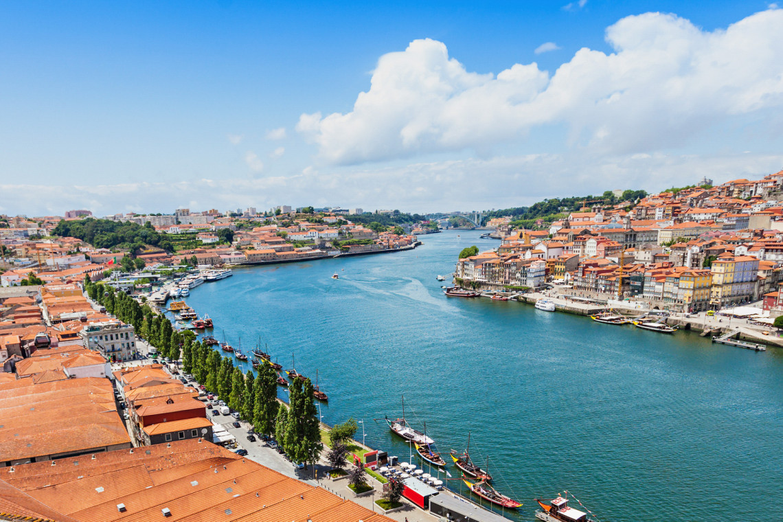 Douro River in Porto, Portugal oporto-porto-portugal-city-river-bridge-don-luis-boats-boat-excursions-cruises-riverline