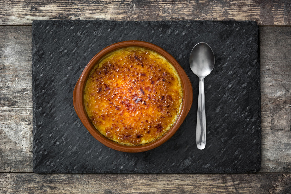 Crema Cataplana, Dessert in Spain delicious-traditional-spanish-dessert-crema-catalana-served-with-spoon-in-clay-bowl