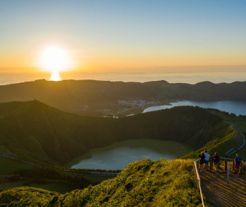 Sunset View Over Sete Cidades Crater Lakes During Azores Group Tour on São Miguel Island Small group of travelers watching the sunset over Sete Cidades crater lakes on São Miguel Island, Azores