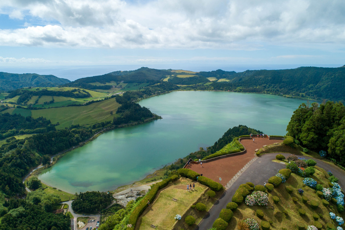 Aerial Perspective of Pico do Ferro Viewpoint and Furnas Valley in São Miguel Aerial view of Pico do Ferro viewpoint and Furnas Lake surrounded by lush landscape in São Miguel, Azores.