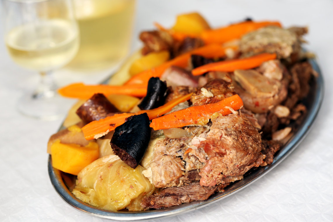 Cozido das Furnas in São Miguel Island, Azores Traditional Portuguese dishes, the Azores, the region Furnas .Switch in restaurants, cooked in boilers The various types of meat and cabbage with potatoes and carrots.