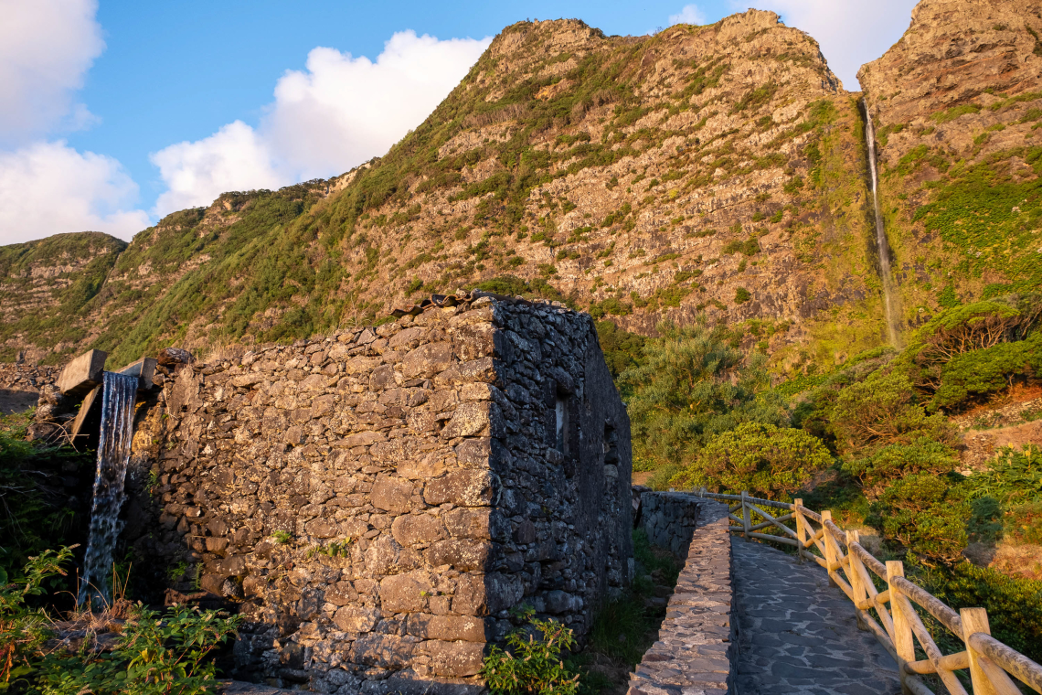 Poço do Bacalhau trail in Flores island leads to a beautiful waterfall, Azores, Portugal