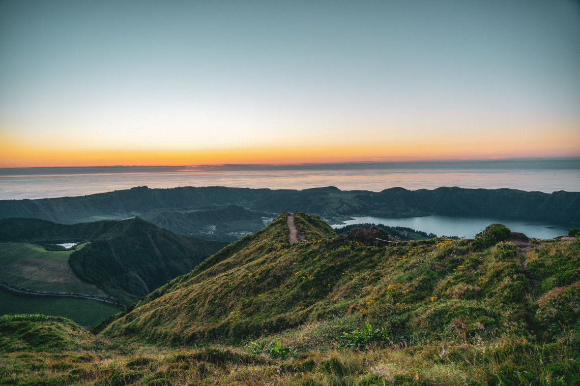 Tips for your Azores hiking adventure. This photo is in Boca do Inferno viewpoint at sunset in Sete Cidades, Sao Miguel Island, Azores, Portugal.