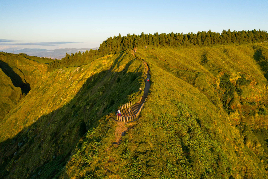 Aerial view of the Boca do Inferno trail leading to a scenic viewpoint over the crater ridge in Sete Cidades, São Miguel Island
