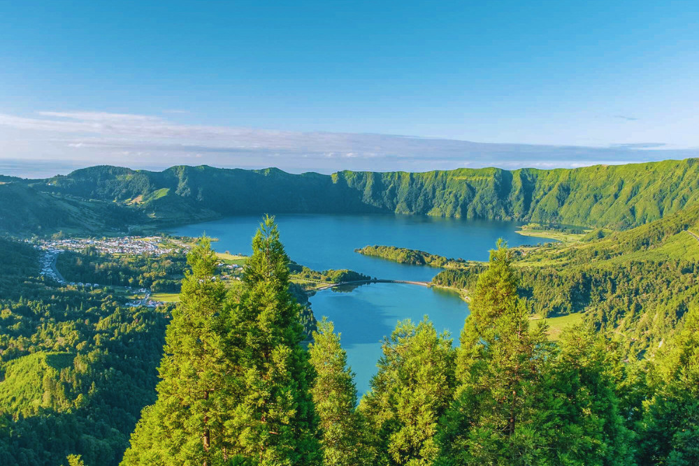 Scenic view of Sete Cidades twin lakes and lush volcanic landscape from Vista do Rei viewpoint in São Miguel, Azores