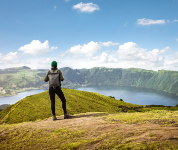 Woman enjoying the scenic views of the caldera on São Miguel island in the Azores Woman enjoying the scenic views of the caldera on São Miguel island in the Azores