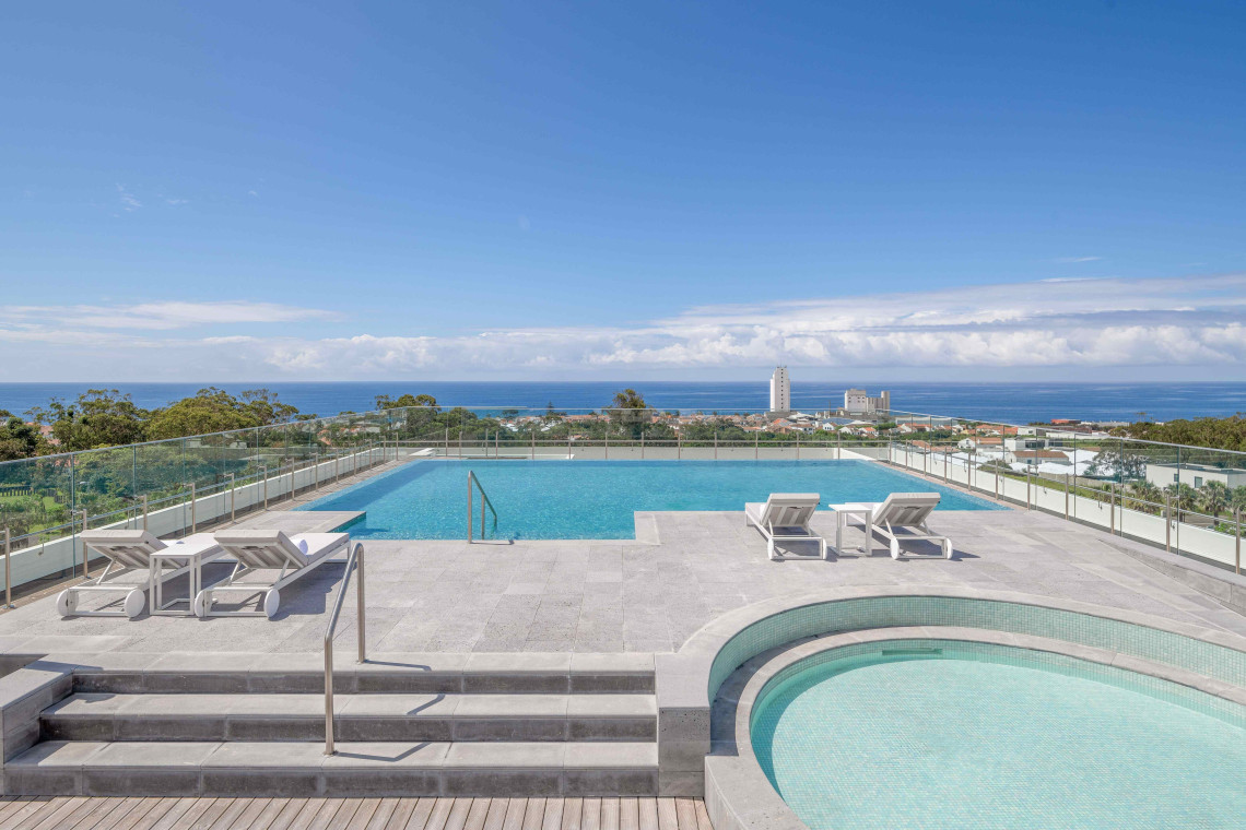 Rooftop pool and hot tub with panoramic ocean views at DoubleTree by Hilton Hotel in Lagoa, São Miguel Island, Azores.