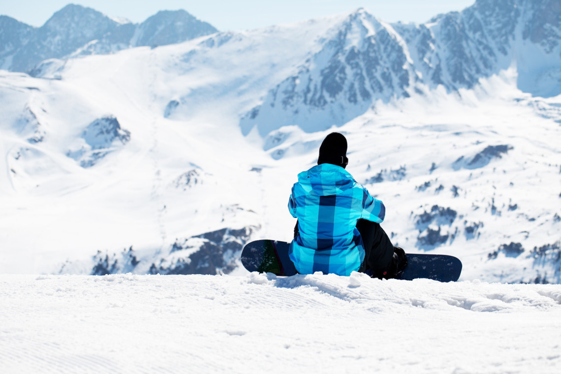 Snowboarder enjoying the nature in mountains snowboarder-enjoying-the-nature-in-mountains