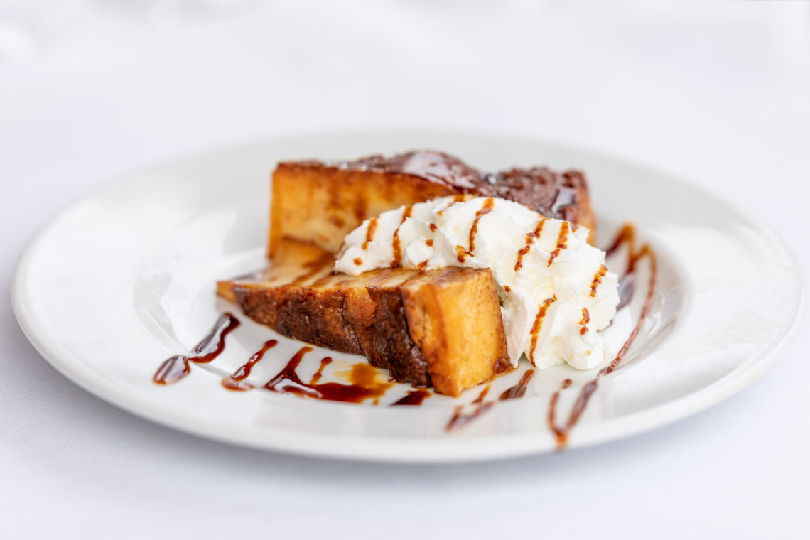 Traditional spanish dessert Ibizan Greixonera (Balearic pudding) with whipped cream traditional-spanish-dessert-ibizan-greixonera-balearic-pudding-with-whipped-cream