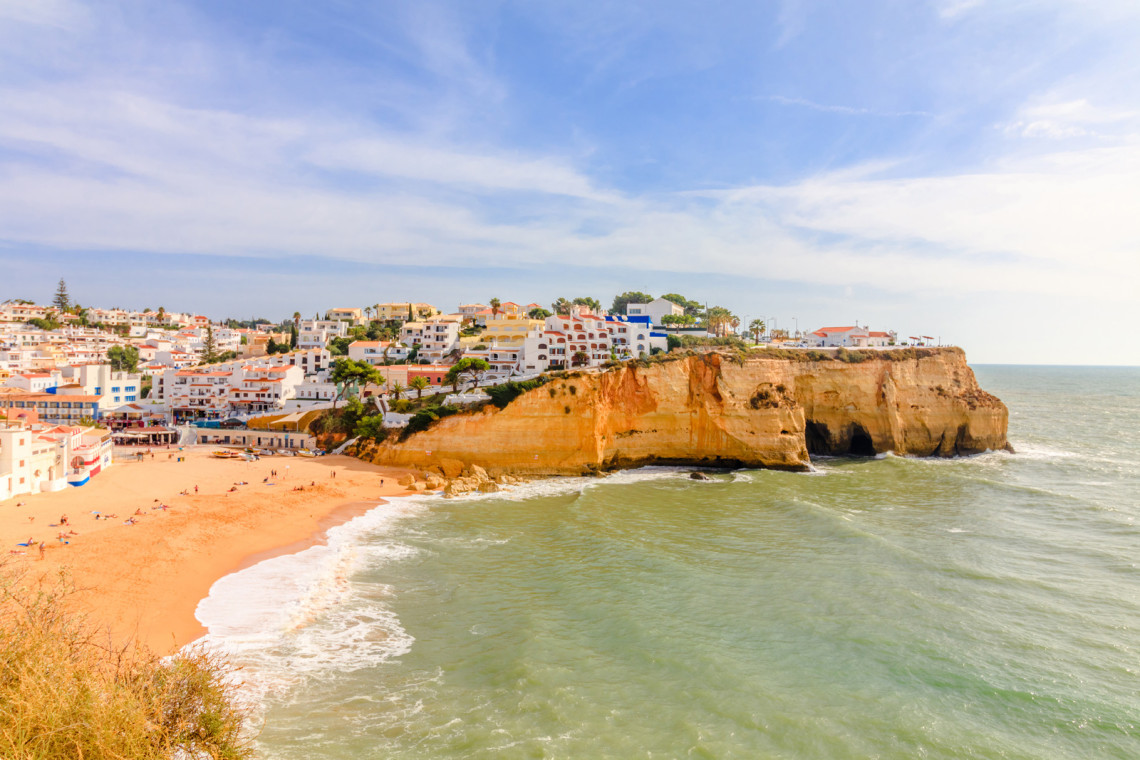 carvoeiro-beach-in-the-algarve-region-of-portugal-sand-ocean-buildings